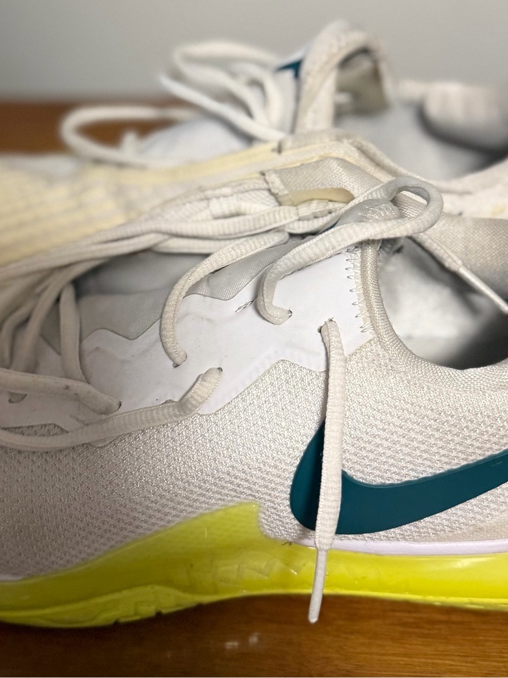 Nike Kids White Sneakers with Teal Swoosh and Yellow Sole